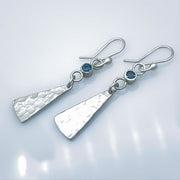 London Blue Topaz Sterling Silver Triangle Drop Earrings laying diagonal
