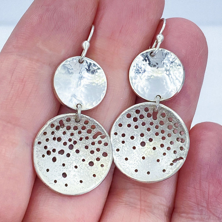 Sterling Silver Hammered and Distressed Disc Earrings size comparison to hand