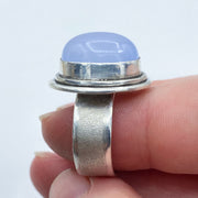 Oval Blue Chalcedony Brushed Sterling Silver Ring on Finger Side View