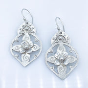 Pierced Floral Arabesque Sterling Silver Earrings Laying Flat