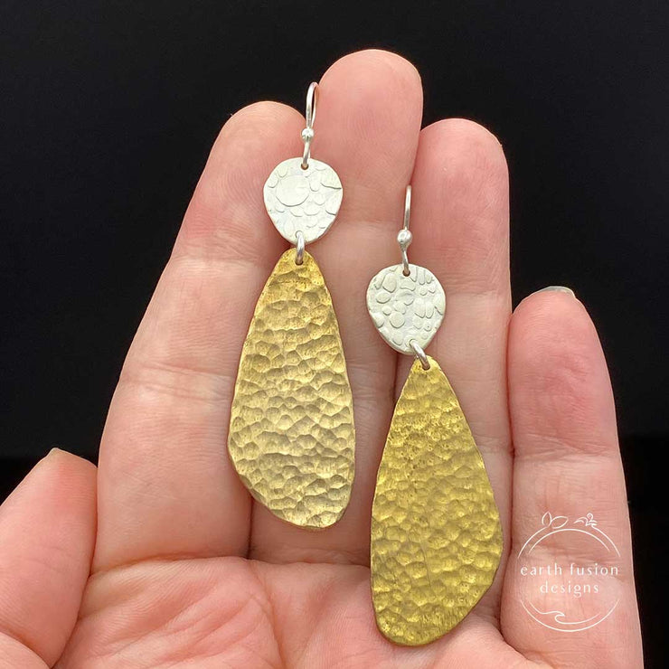 Textured Sterling Silver and Hammered Brass Abstract Earrings size comparison to hand