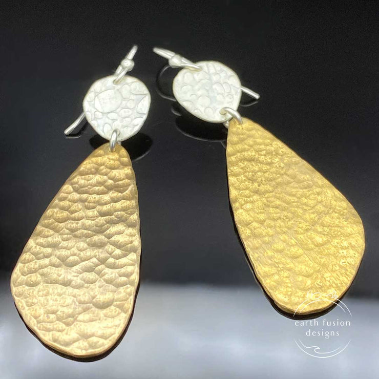 Textured Sterling Silver and Hammered Brass Abstract Earrings Laying Flat