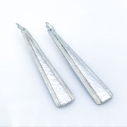 Sterling Silver Double Triangle Earrings laying diagonal