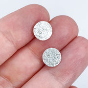 Sterling Silver Erosion Textured Disc Post Earrings size comparison to hand