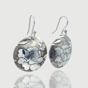 Sterling-Silver-Floral-Textured-Domed-Medallion-Earrings Three quarter view