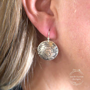 Sterling Silver Floral Textured Domed Medallion Earrings on Model
