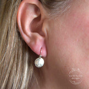Sterling Silver Hammered Disc Earrings on Model