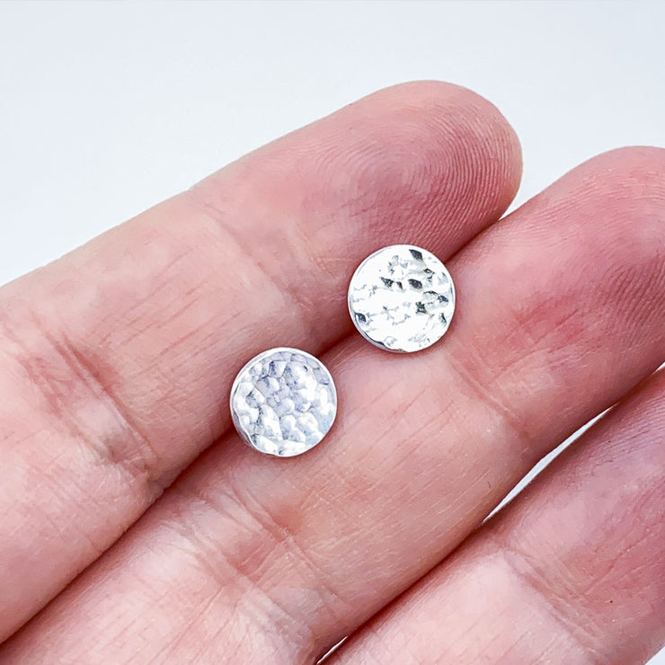 Sterling Silver Hammered Disc Post Earrings Medium Size comparison to hand