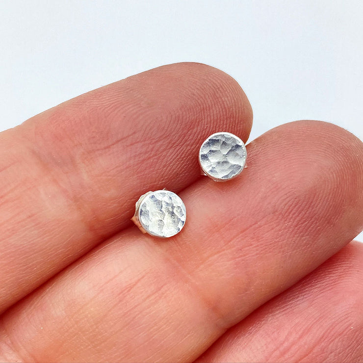 Sterling Silver Hammered Disc Post Earrings Small Size comparison to hand
