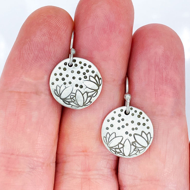 Sterling Silver Lotus Flower Stamped Disc Earrings size comparison to hand