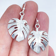 Sterling Silver Monstera Leaf Earrings size comparison to hand