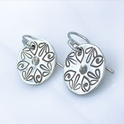 Sterling Silver Radiant Petal Stamped Disc Earrings Closeup