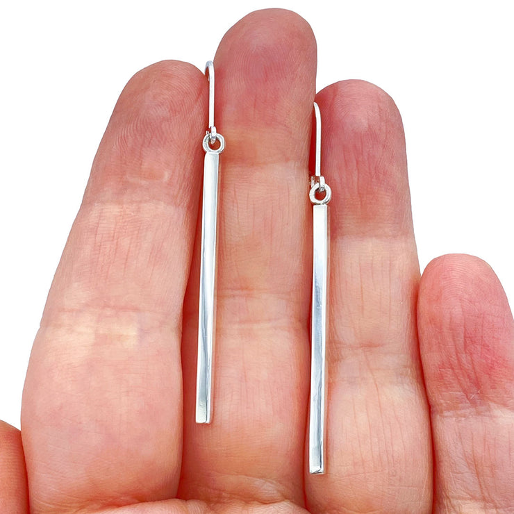 Sterling Silver Modern Stick Earrings in hand