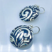 Sterling Silver Swirl Textured Domed Medallion Earrings side view