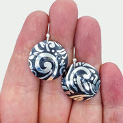 Sterling Silver Swirl Textured Domed Medallion Earrings Size Compared to Hand