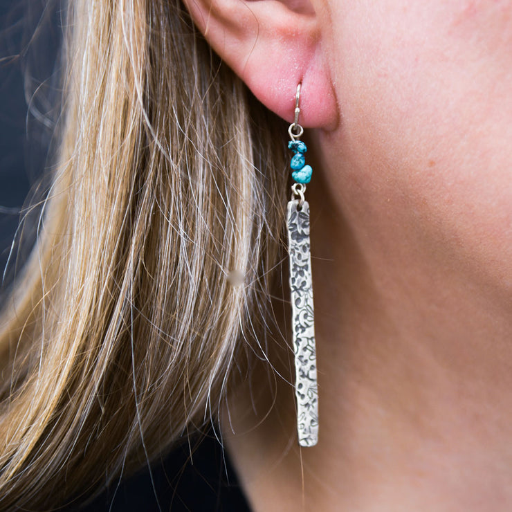 Sterling Silver Floral Bar Earrings with Turquoise Beads on model