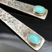 Turquoise Sterling Silver Triangle Earrings closeup view of turquoise