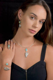 Royston Turquoise Sterling Silver Double Leaf Repoussé Ring on Model